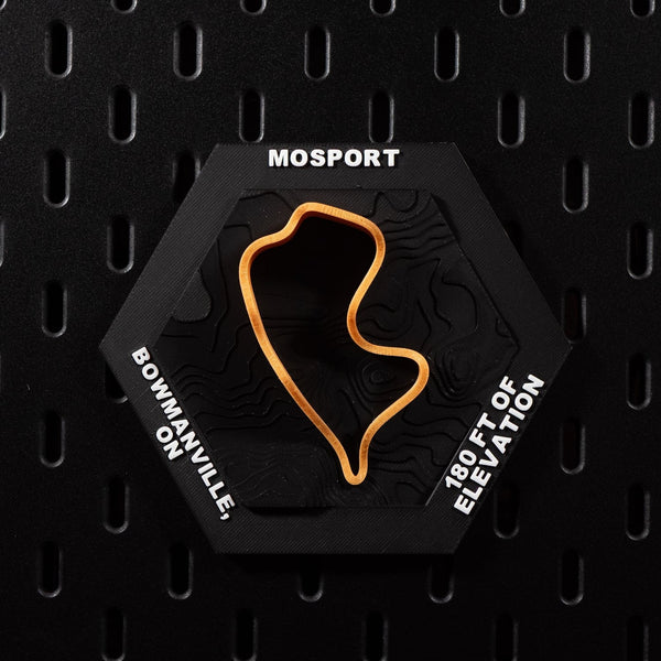 Mosport hex flat on black pegboard, bright orange circuit loop over black contour terrain