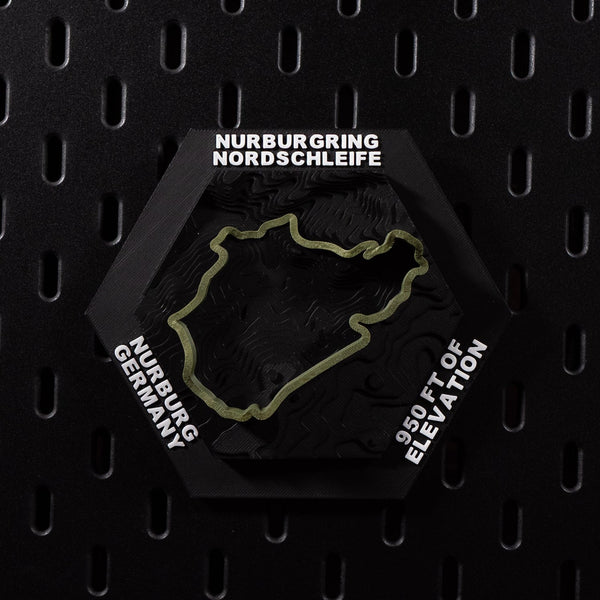 Nürburgring Nordschleife hex flat on black pegboard, olive green lap over terraced terrain