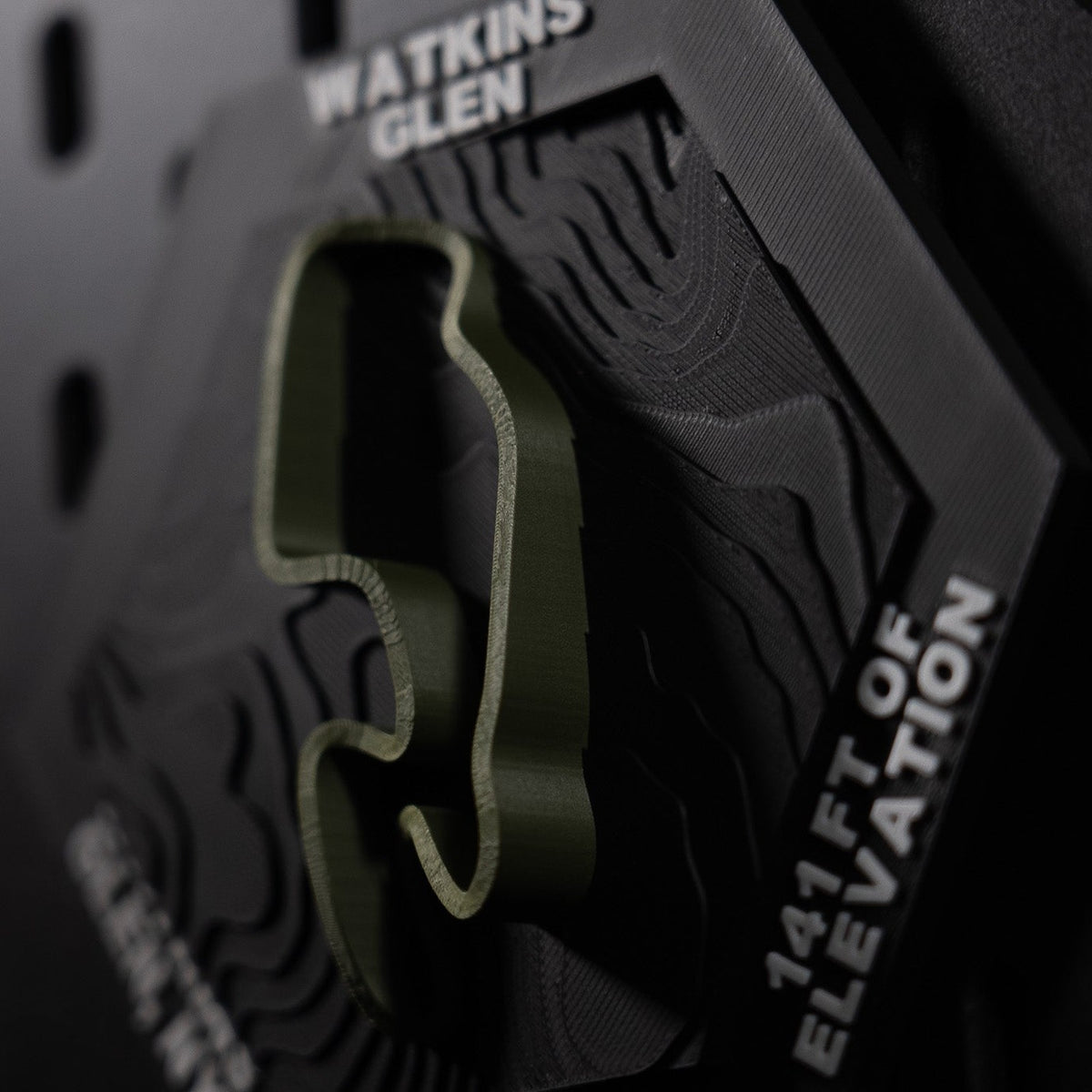 Watkins Glen hex angled, olive circuit and the engraved 141 ft of elevation on the rim