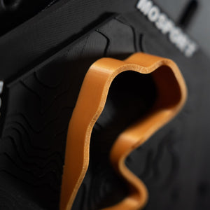 Mosport hex extreme close up, print layer lines visible along the orange ribbon edge