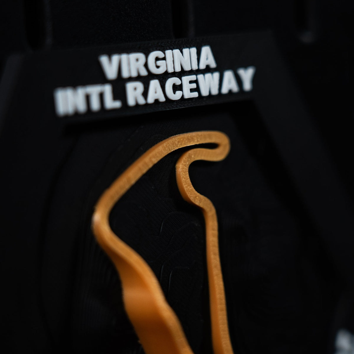 Virginia International Raceway hex close crop, orange ribbon under the engraved header