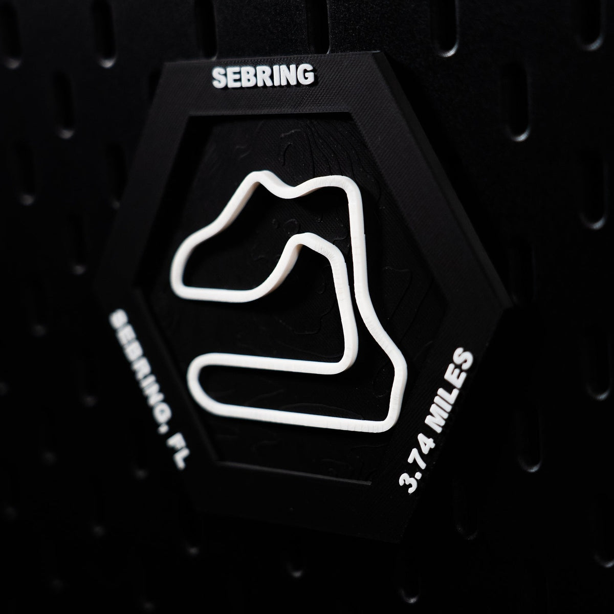 Sebring hex angled on pegboard, whole white lap sharp with both edge inscriptions legible