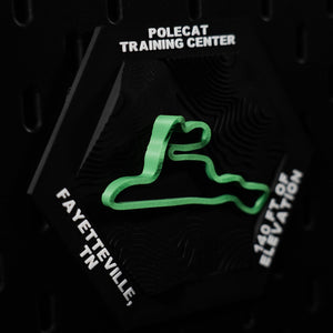 Polecat Training Center hex angled, green loop with Fayetteville, TN engraved on the edge