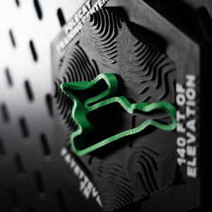 Polecat Training Center hex at a raking angle, green loop above deep contour terracing