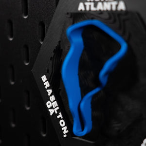 Road Atlanta hex cropped tight on engraved Braselton, GA with the blue loop soft behind