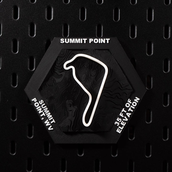 Summit Point hex flat on black pegboard, white circuit loop over near flat black terrain