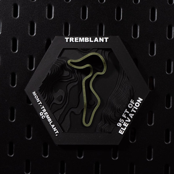 Mont-Tremblant hex flat on black pegboard, olive green circuit loop on terraced terrain