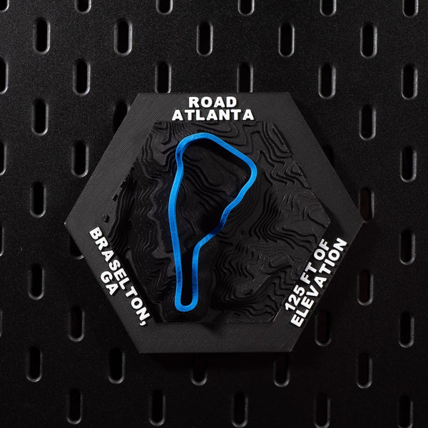 Road Atlanta hex flat on black pegboard, blue circuit loop raised over black contour terrain