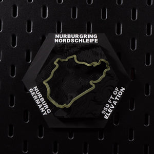 Nürburgring Nordschleife hex flat on black pegboard, olive green lap over terraced terrain