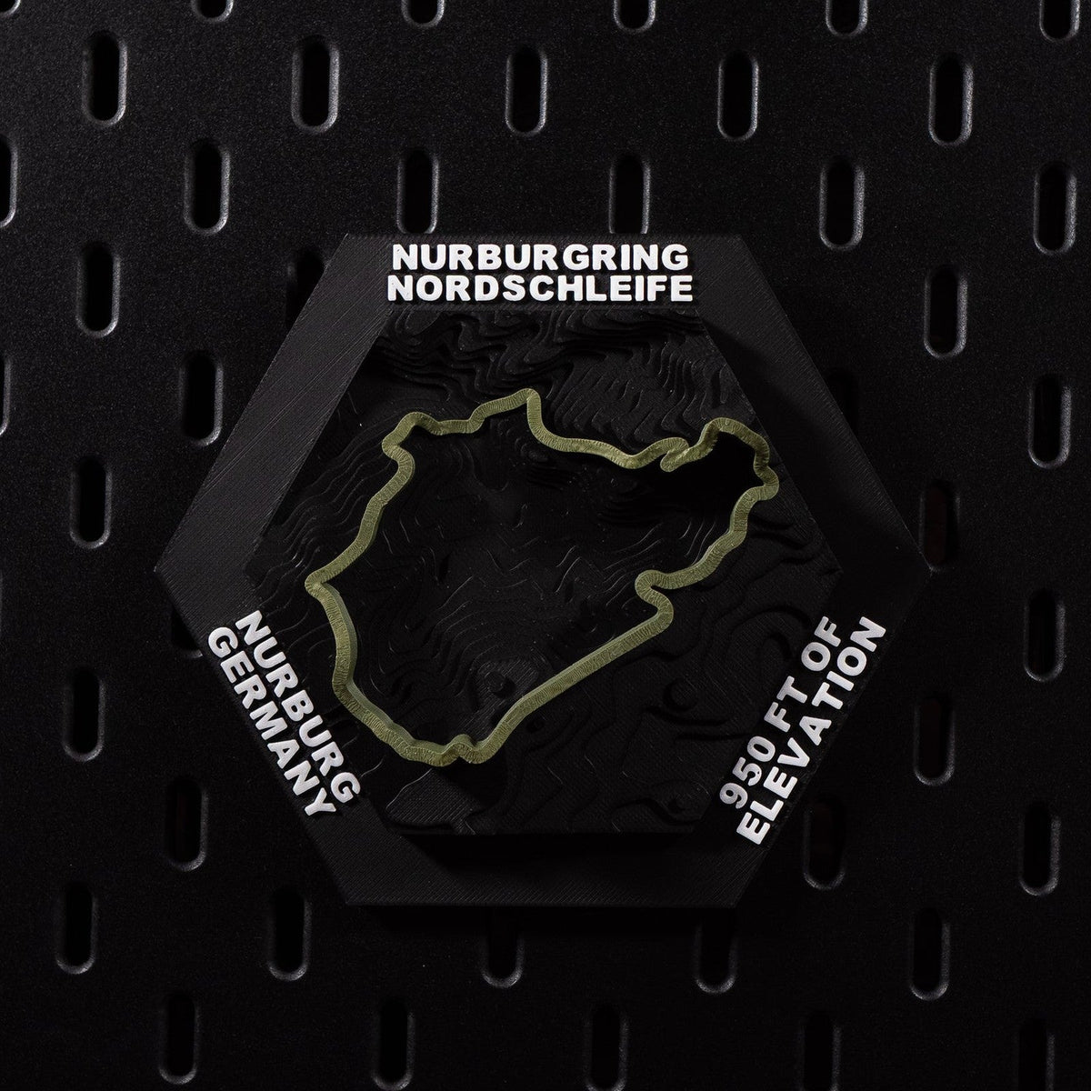 Nürburgring Nordschleife hex flat on black pegboard, olive green lap over terraced terrain