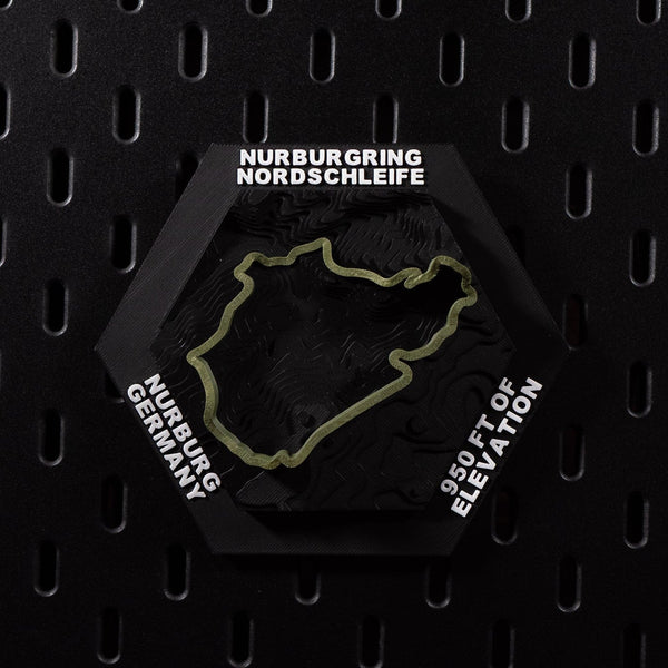 Nürburgring Nordschleife hex flat on black pegboard, olive green lap over terraced terrain